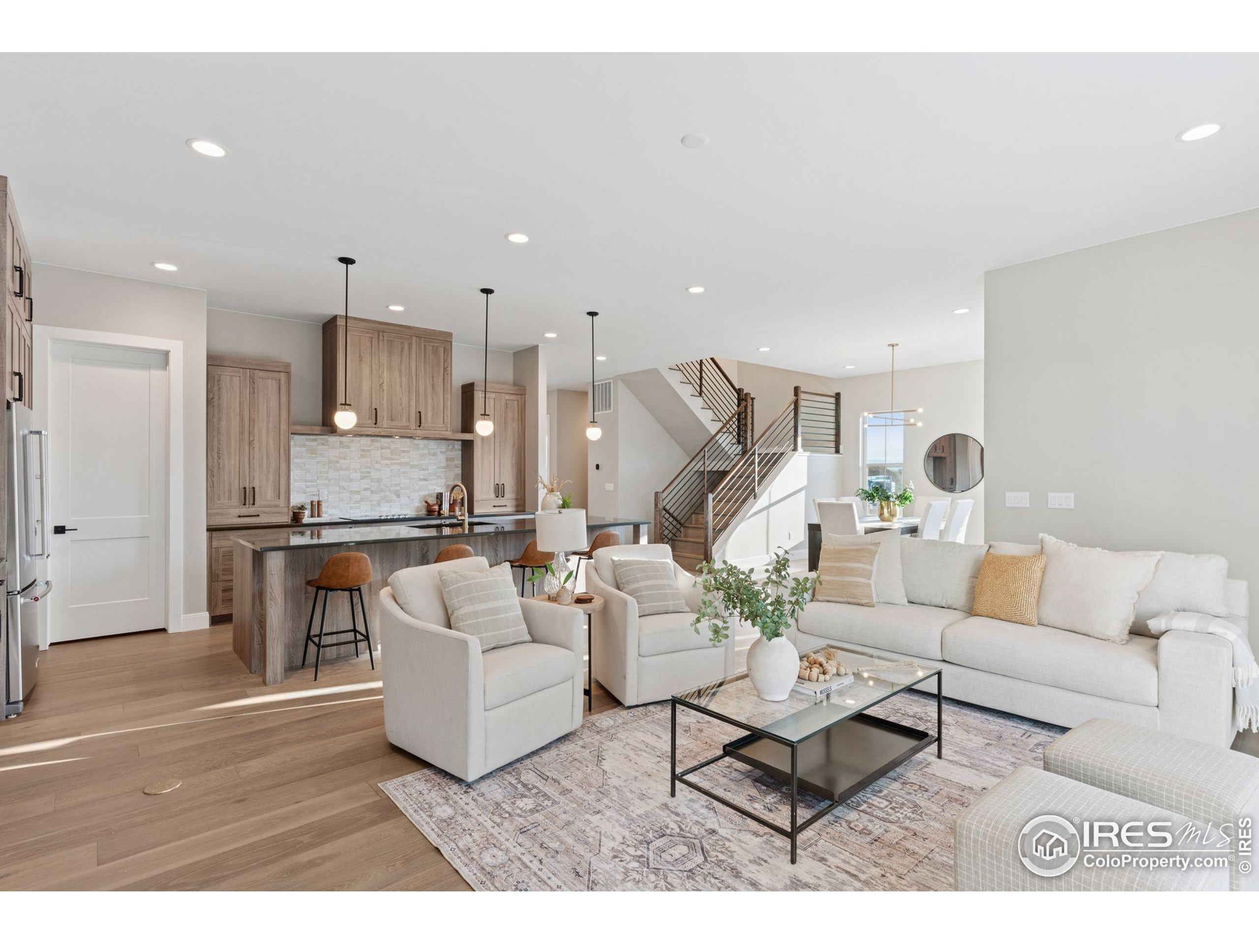 927 William Way Berthoud, CO 80513 - Photo 10 of 28 a living room with furniture and a wooden floor