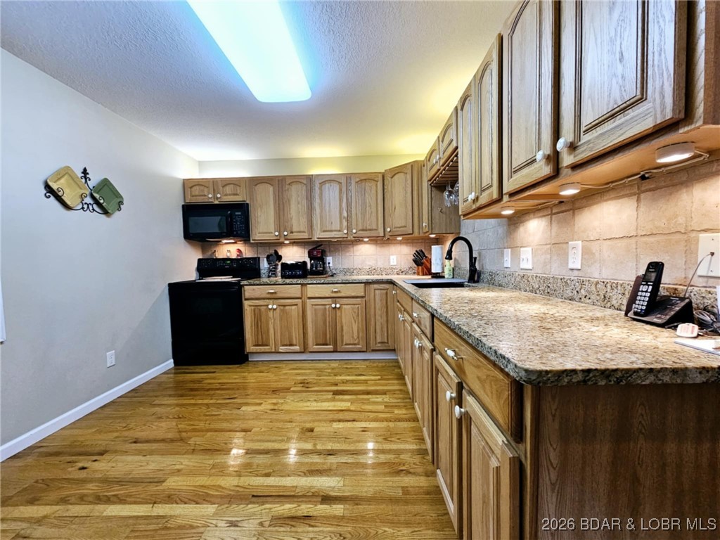 1185 Oval Road Climax Springs, MO 65324 - Photo 18 of 47 Main floor kitchen with granite countertops and wo