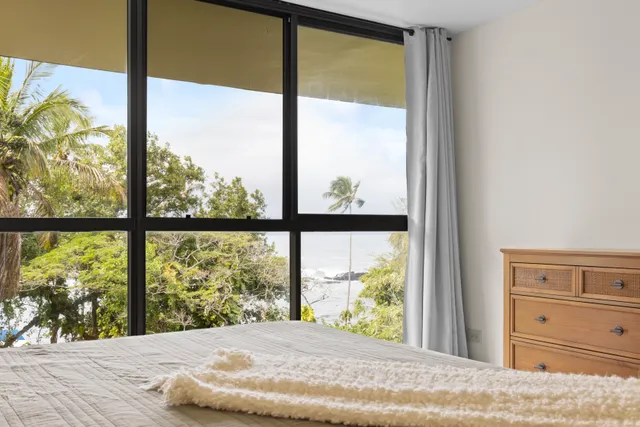 a view of a house with swimming pool and sitting area