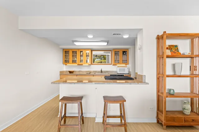 a bathroom with a toilet a sink and a mirror