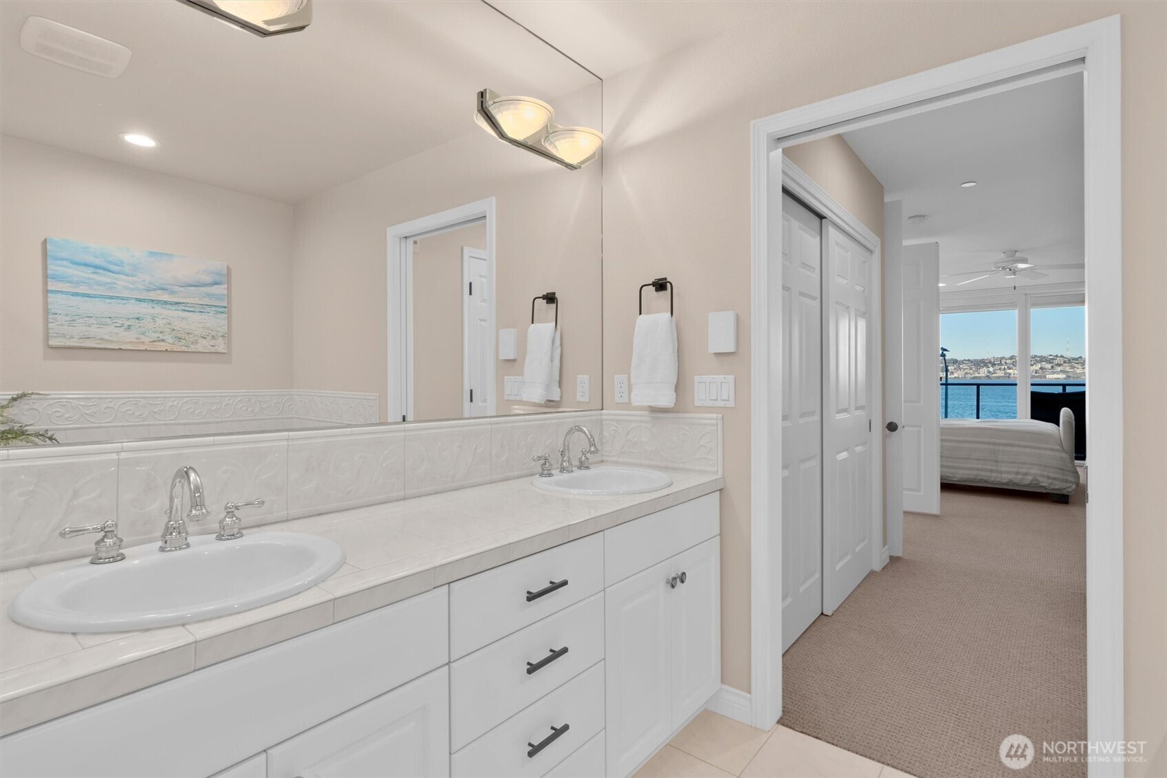 1005 Harbor Avenue Southwest, Unit 400 Seattle, WA 98116 - Photo 16 of 39 a en suite bathroom with double sink and a large mirror