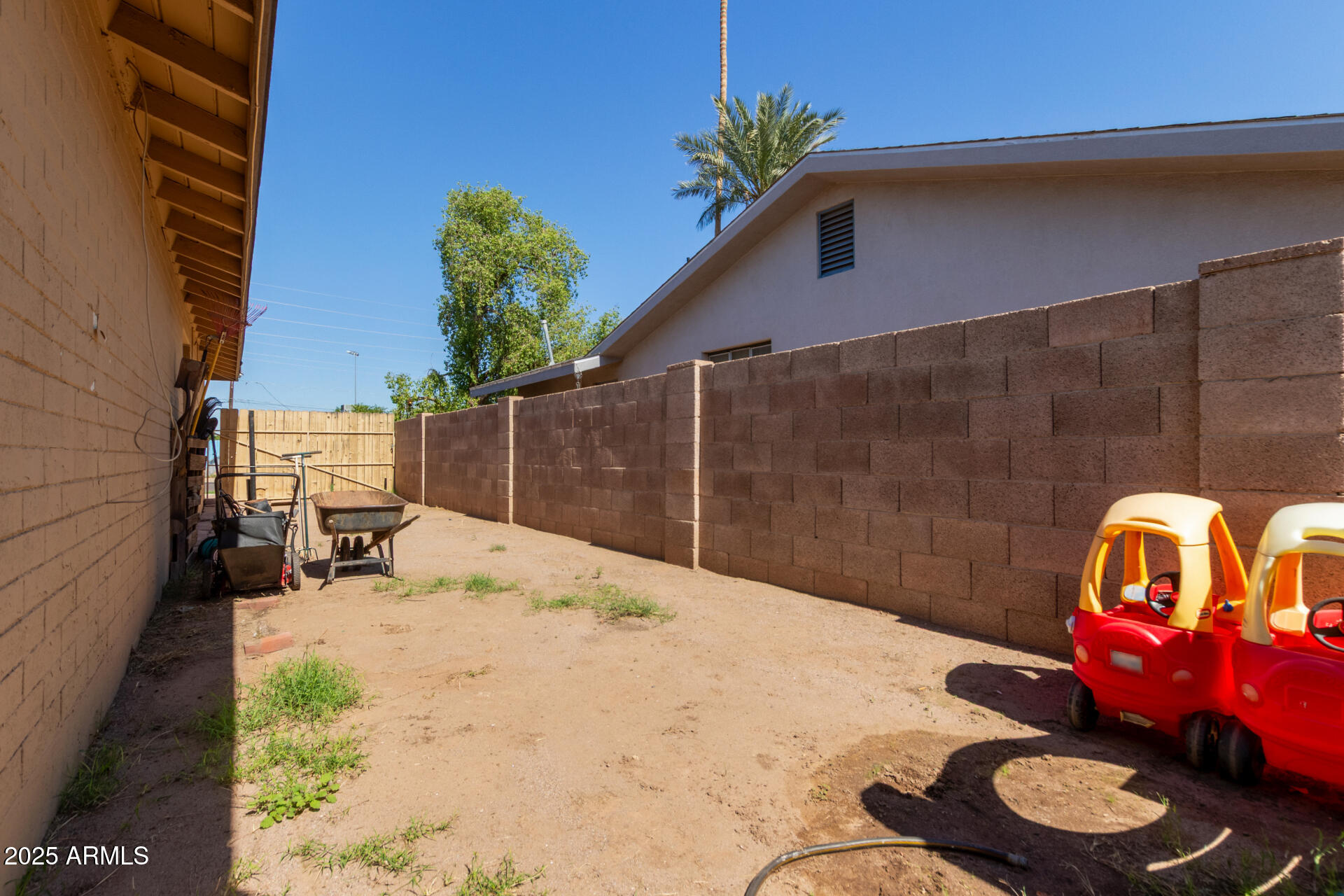 5439 West Osborn Road Phoenix, AZ 85031 - Photo 19 of 22 a backyard of a house with fire pit