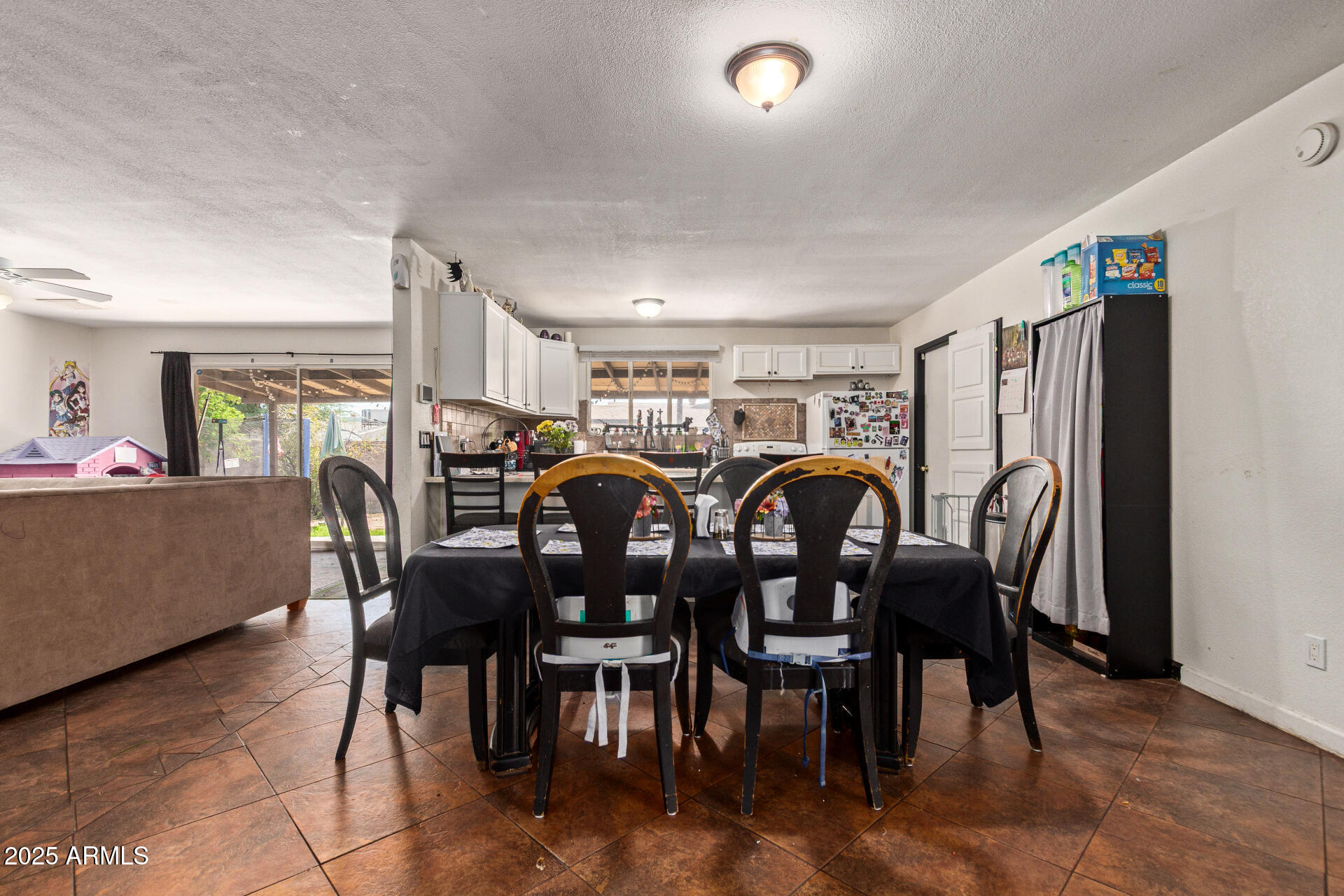 5439 West Osborn Road Phoenix, AZ 85031 - Photo 6 of 22 a view of a dining room with furniture and chandelier