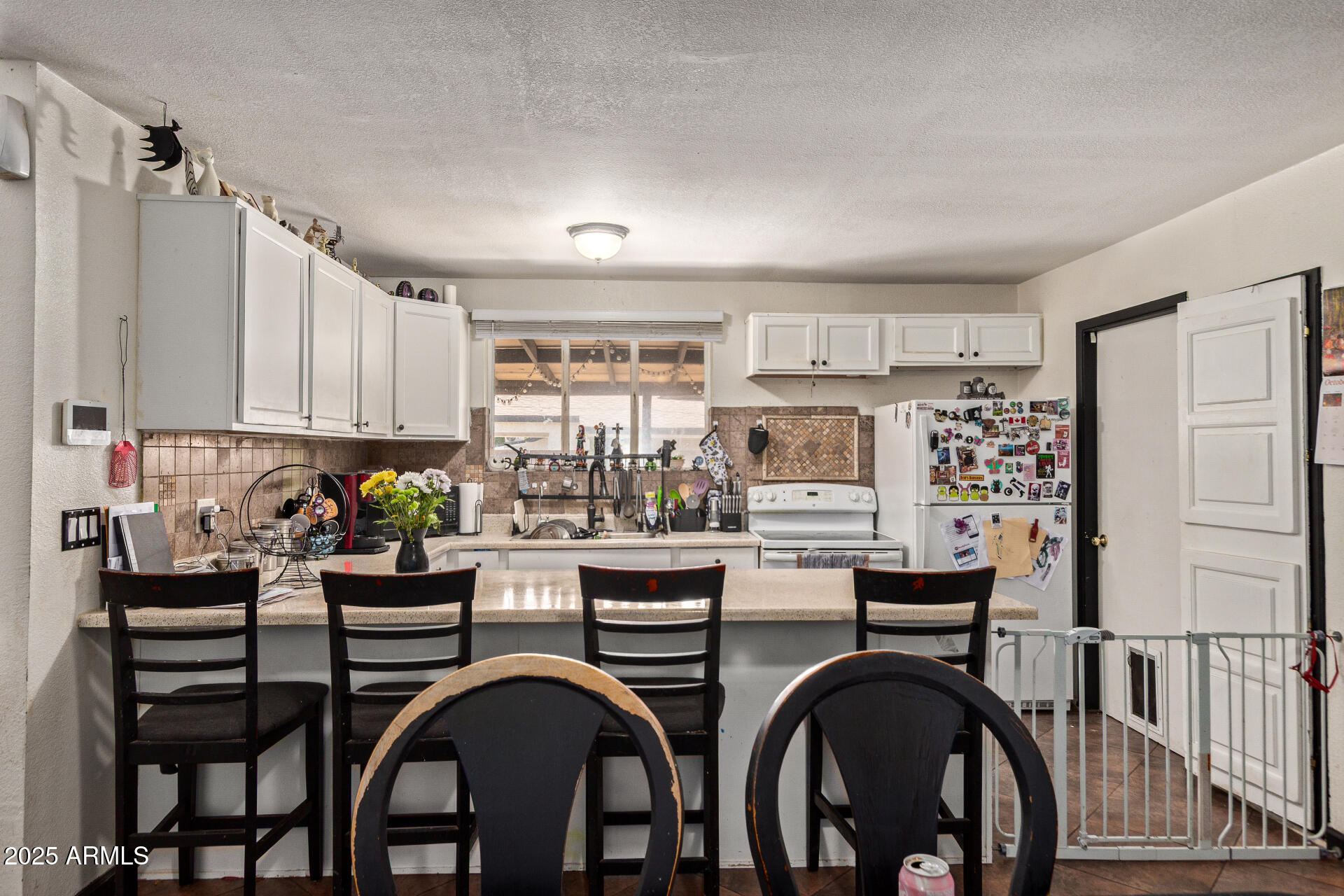 5439 West Osborn Road Phoenix, AZ 85031 - Photo 7 of 22 a kitchen with sink and cabinets