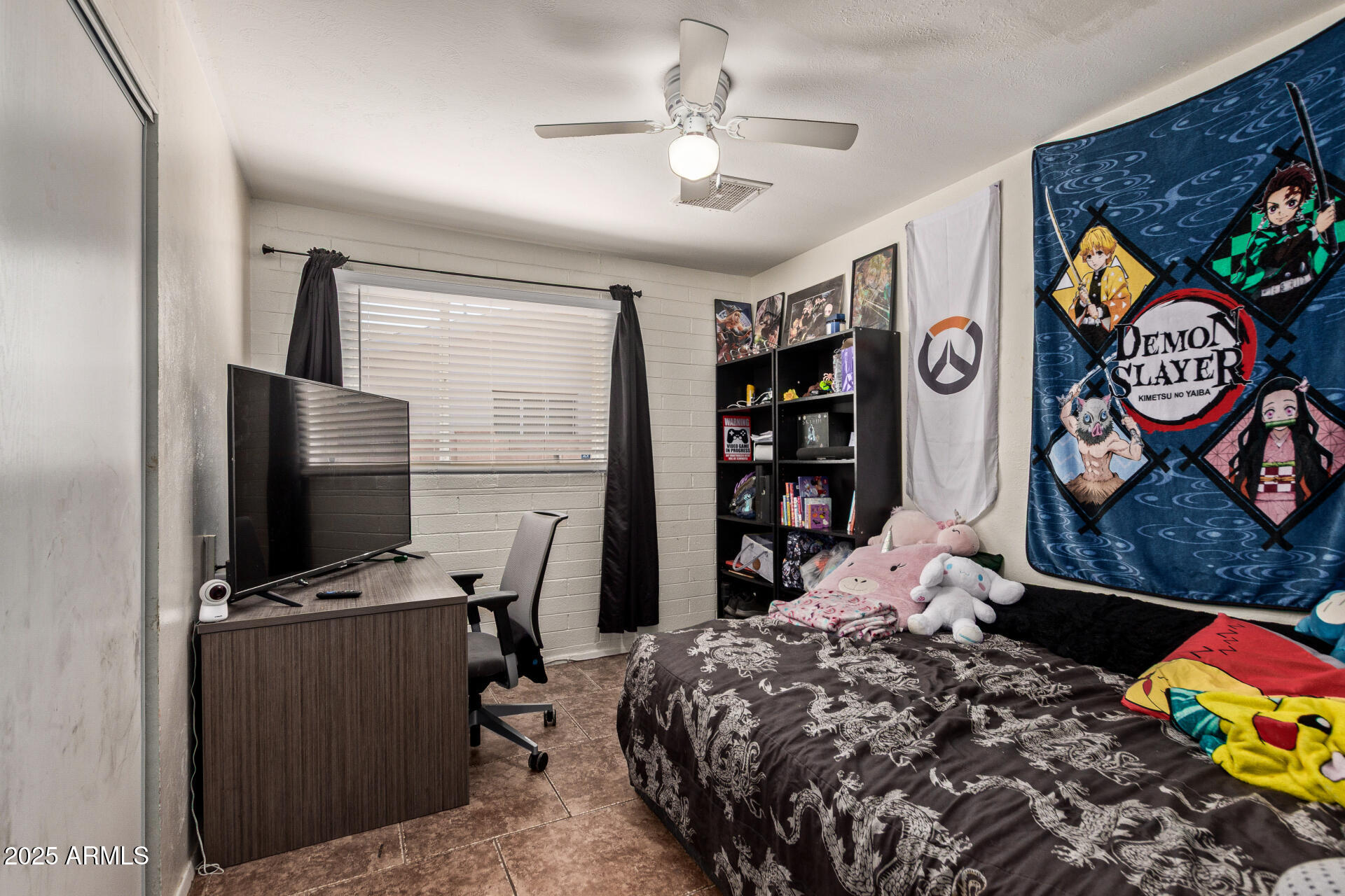 5439 West Osborn Road Phoenix, AZ 85031 - Photo 9 of 22 a bedroom with a bed and painting on the wall