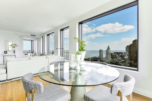 a dining room with table and chairs