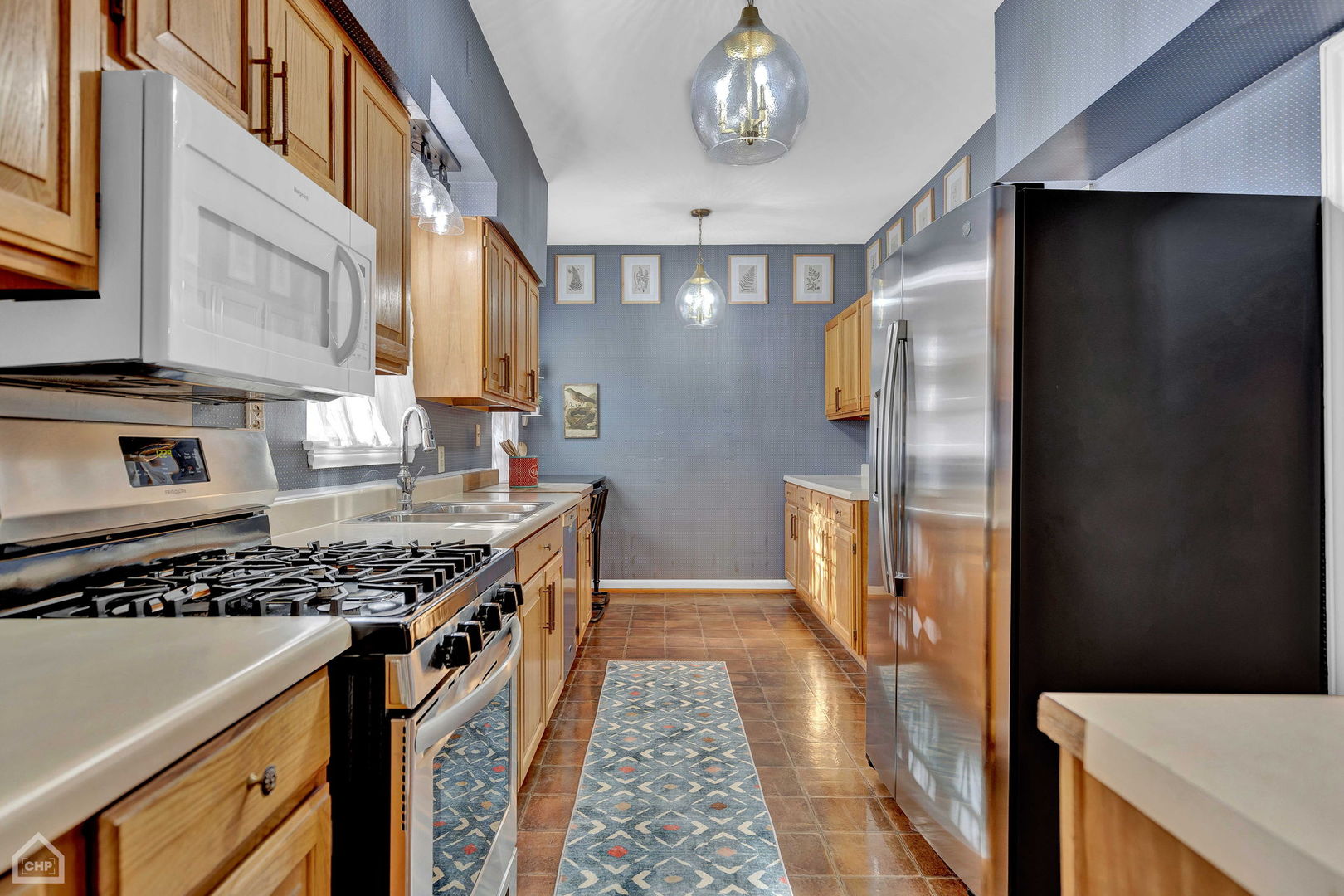 17830 Tipton Avenue Homewood, IL 60430 - Photo 21 of 40 a kitchen with stainless steel appliances granite countertop a stove and a refrigerator