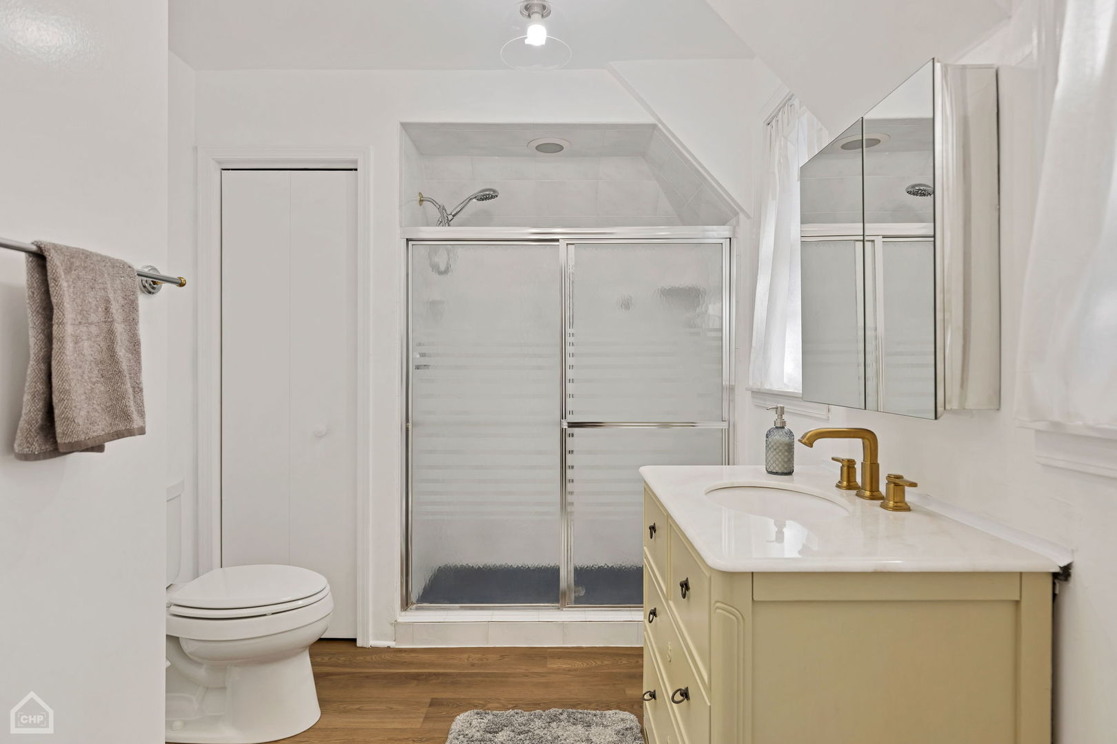 17830 Tipton Avenue Homewood, IL 60430 - Photo 33 of 40 a bathroom with a sink a toilet and shower