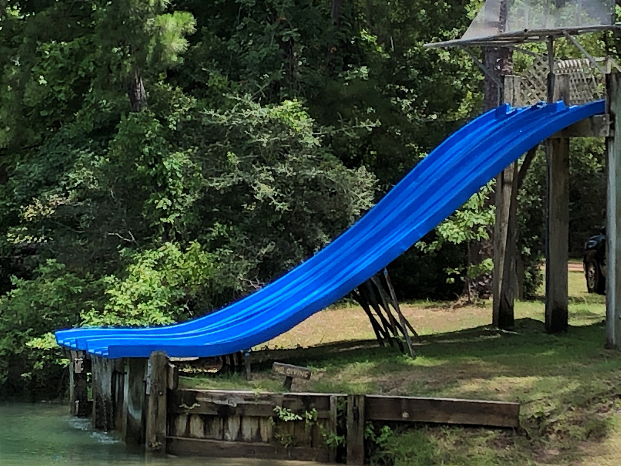 77 Raccoon Ramble Cleveland, TX 77327 - Photo 31 of 33 And swim lake with giant slides...