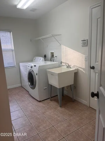 a utility room with washer and dryer