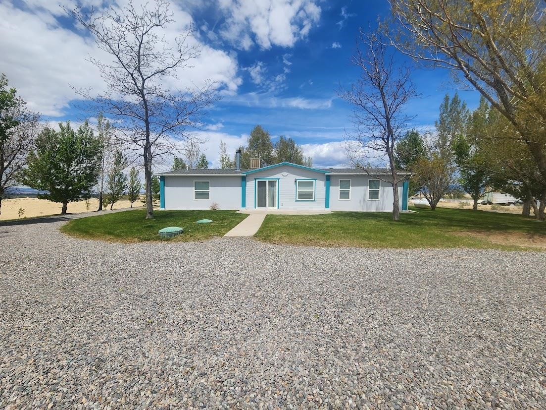 19548 B50 Road Delta, CO 81416 - Photo 32 of 37 a view of a house with a yard