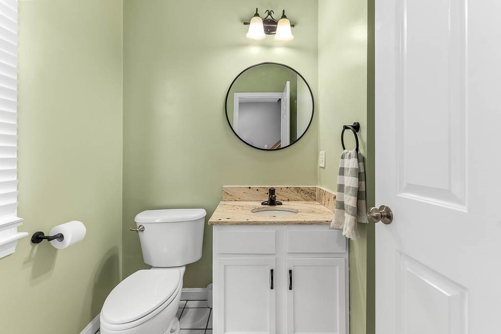 272 Union Street, Unit 272 Walpole, MA 02032 - Photo 13 of 27 a bathroom with a toilet sink vanity and mirror