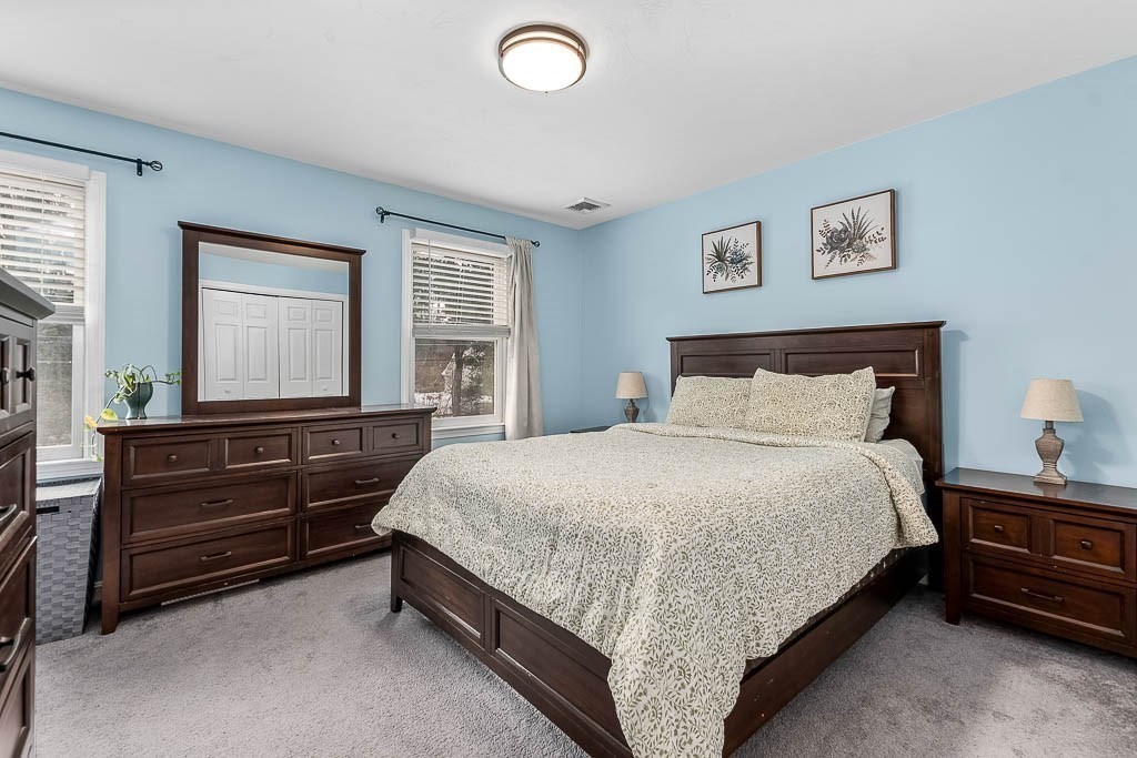 272 Union Street, Unit 272 Walpole, MA 02032 - Photo 14 of 27 a bedroom with a bed and window