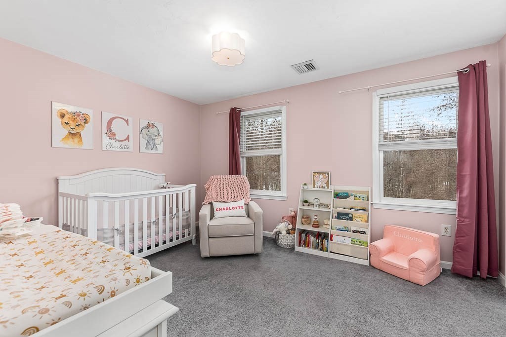 272 Union Street, Unit 272 Walpole, MA 02032 - Photo 17 of 27 a bedroom with furniture and a window