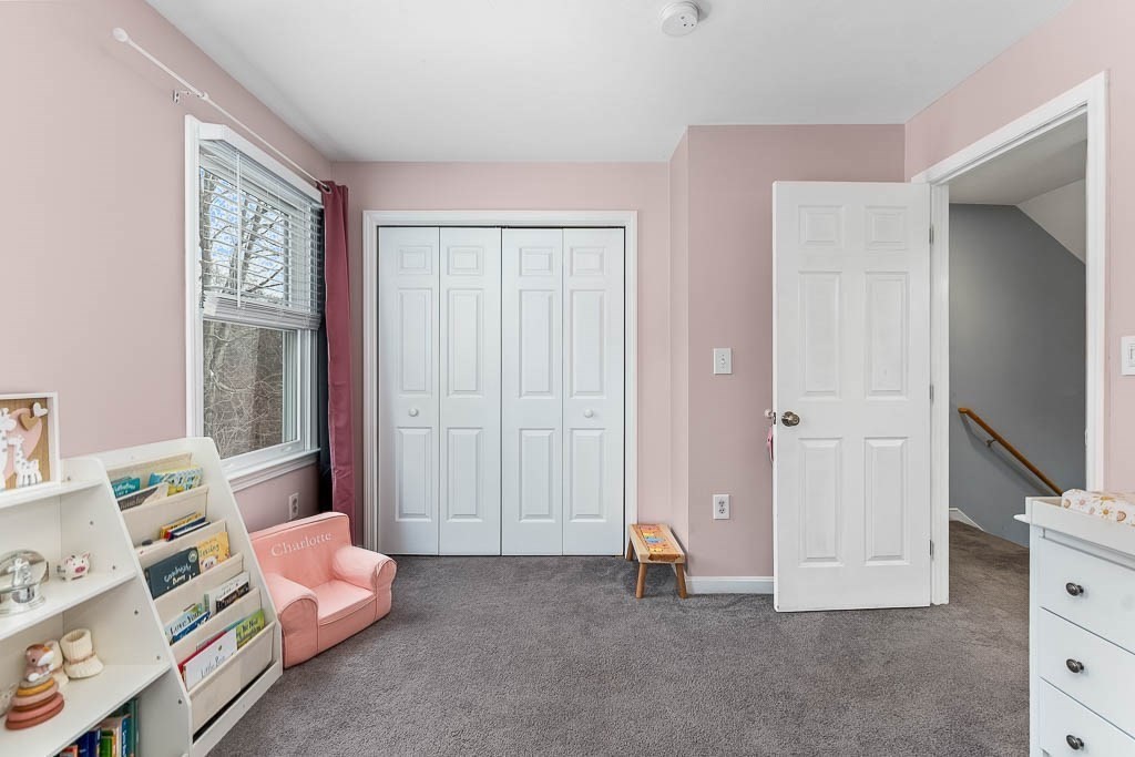 272 Union Street, Unit 272 Walpole, MA 02032 - Photo 18 of 27 a spacious bedroom with a bed and a window