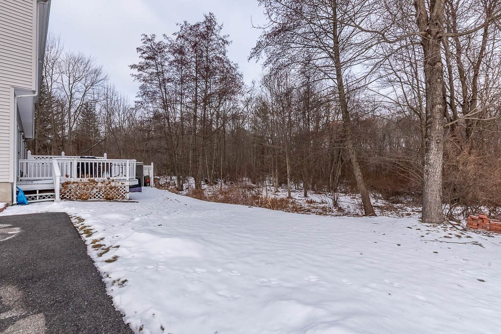 272 Union Street, Unit 272 Walpole, MA 02032 - Photo 24 of 27 a view of a white house that has a tree in it
