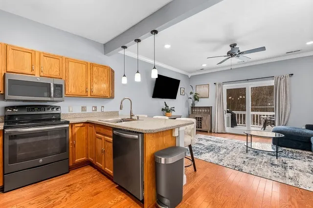 a kitchen with a stove sink and a microwave