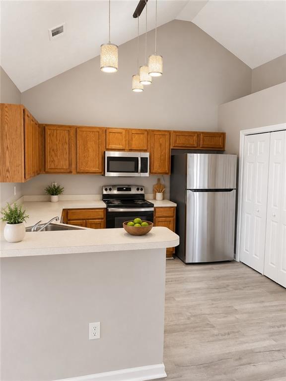 865 McDonough Road Hampton, GA 30228 - Photo 2 of 8 a kitchen with wooden cabinets a refrigerator and a stove top oven