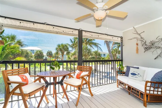 a view of a balcony with chairs