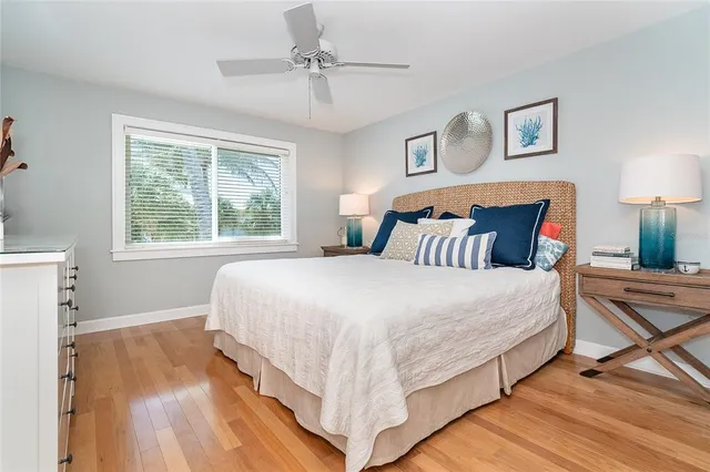 a bedroom with bed and window