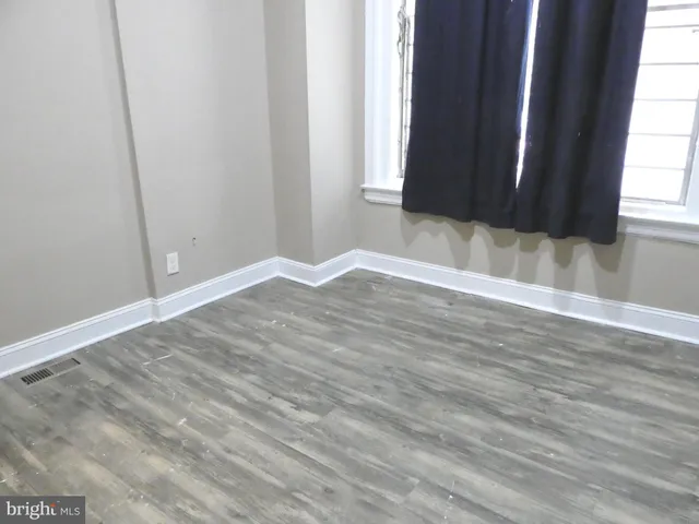 a view of a livingroom with wooden floor