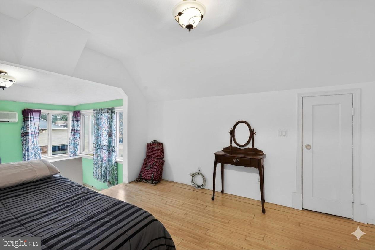 4516 Yates Road Beltsville, MD 20705 - Photo 19 of 31 a bedroom with a bed and a table
