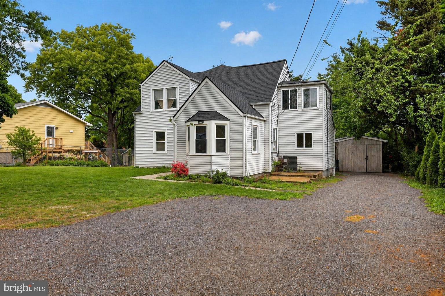 4516 Yates Road Beltsville, MD 20705 - Photo 2 of 31 a front view of a house with a yard and garage