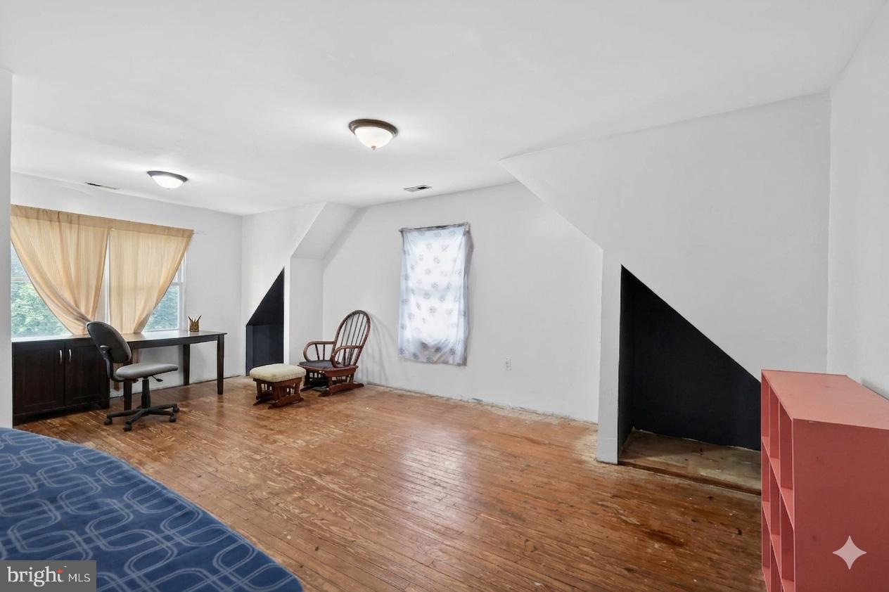 4516 Yates Road Beltsville, MD 20705 - Photo 21 of 31 a living room with furniture window and a wooden floor