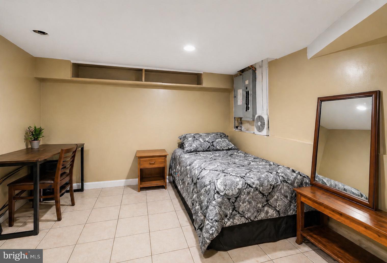 4516 Yates Road Beltsville, MD 20705 - Photo 23 of 31 a bedroom with a bed and a table in it
