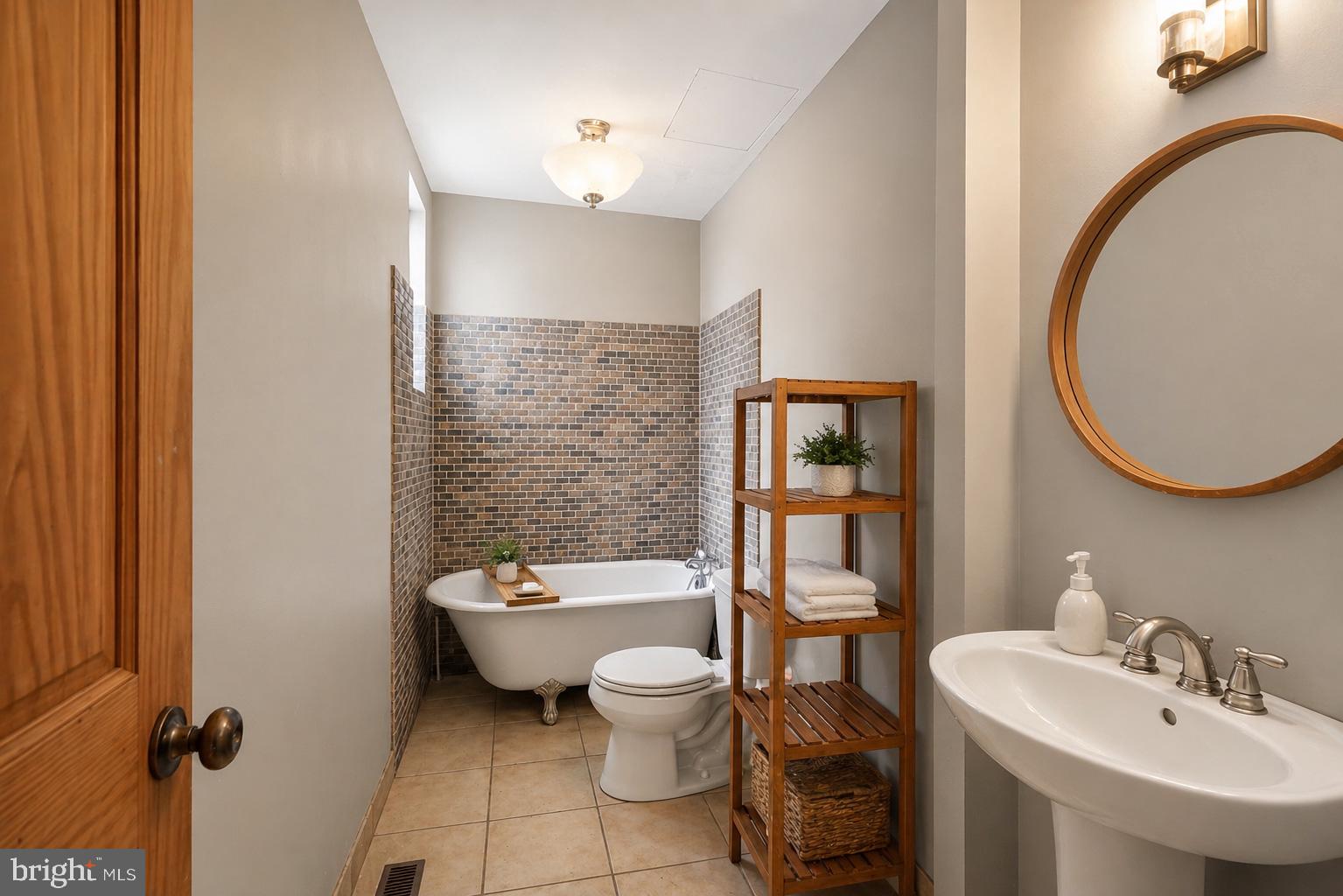 4516 Yates Road Beltsville, MD 20705 - Photo 26 of 31 a bathroom with a toilet a sink and a mirror
