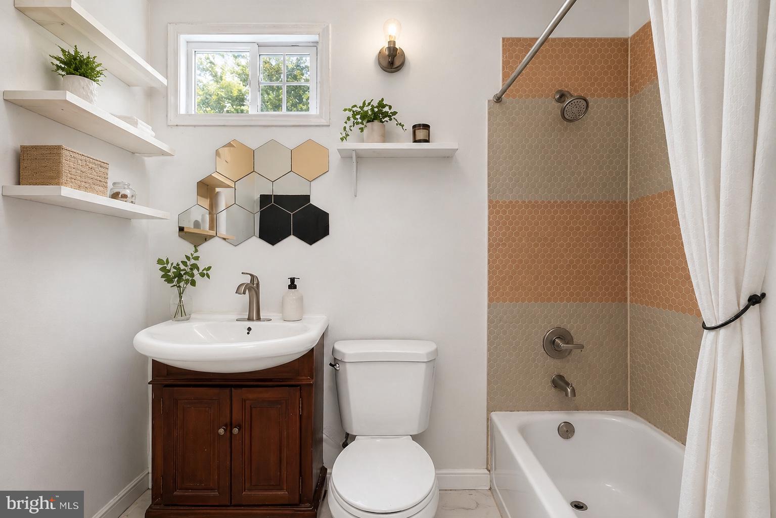 4516 Yates Road Beltsville, MD 20705 - Photo 27 of 31 a bathroom with a sink a toilet and shower