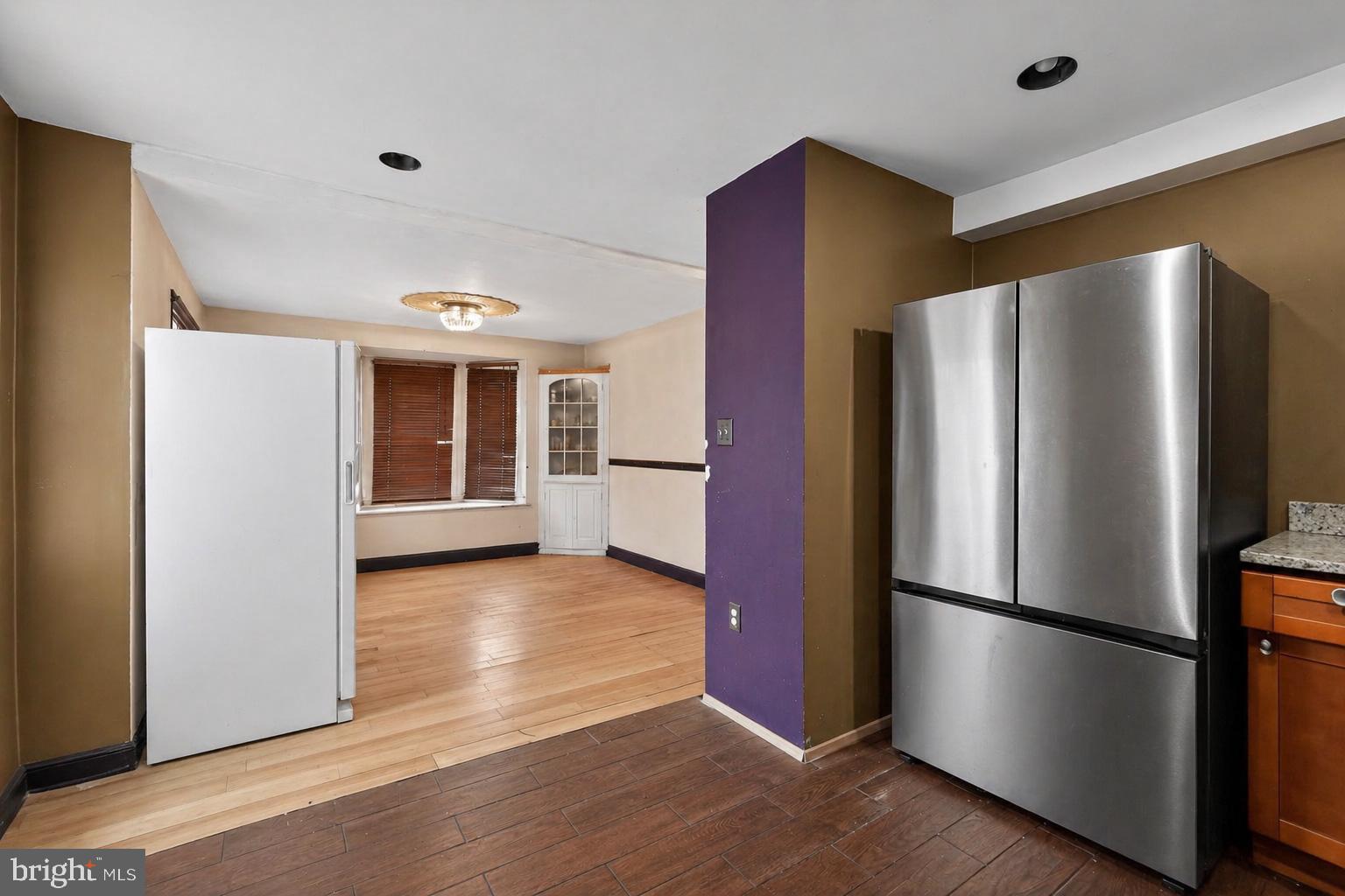 4516 Yates Road Beltsville, MD 20705 - Photo 5 of 31 a metallic refrigerator freezer sitting in a kitchen