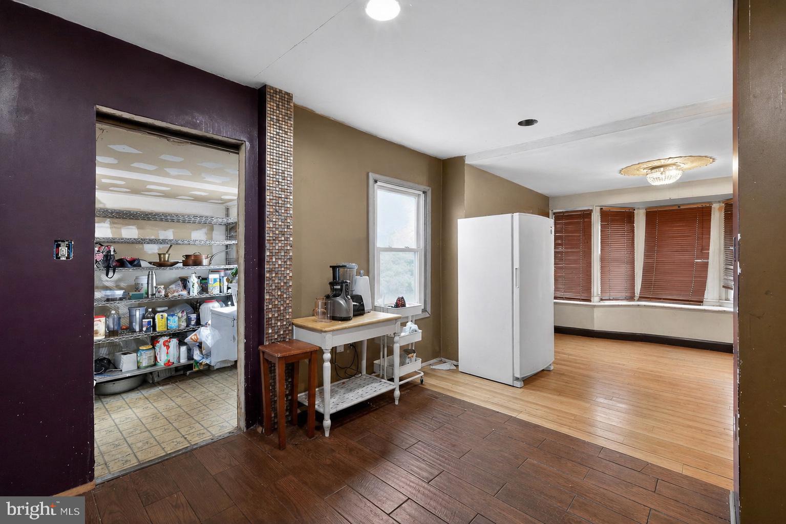 4516 Yates Road Beltsville, MD 20705 - Photo 6 of 31 a view of a bedroom with wooden floor and furniture