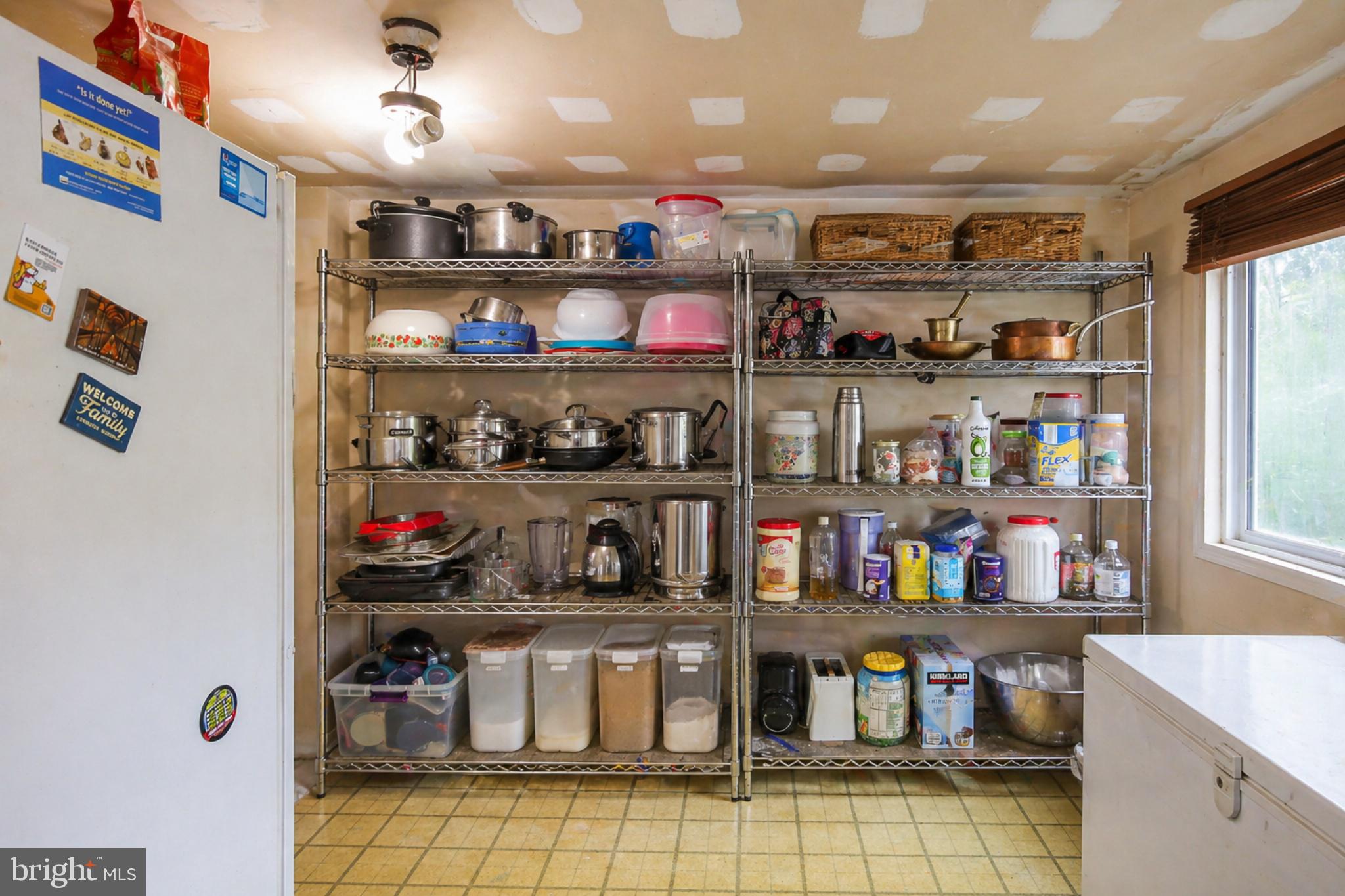 4516 Yates Road Beltsville, MD 20705 - Photo 7 of 31 a kitchen with lots of bottles of alcohol
