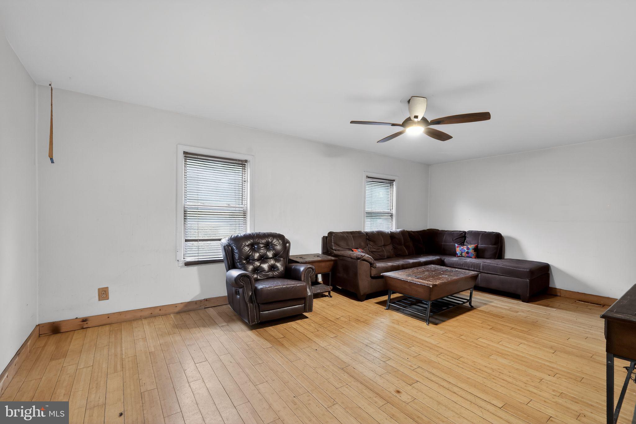 4516 Yates Road Beltsville, MD 20705 - Photo 8 of 31 a living room with furniture and a wooden floor