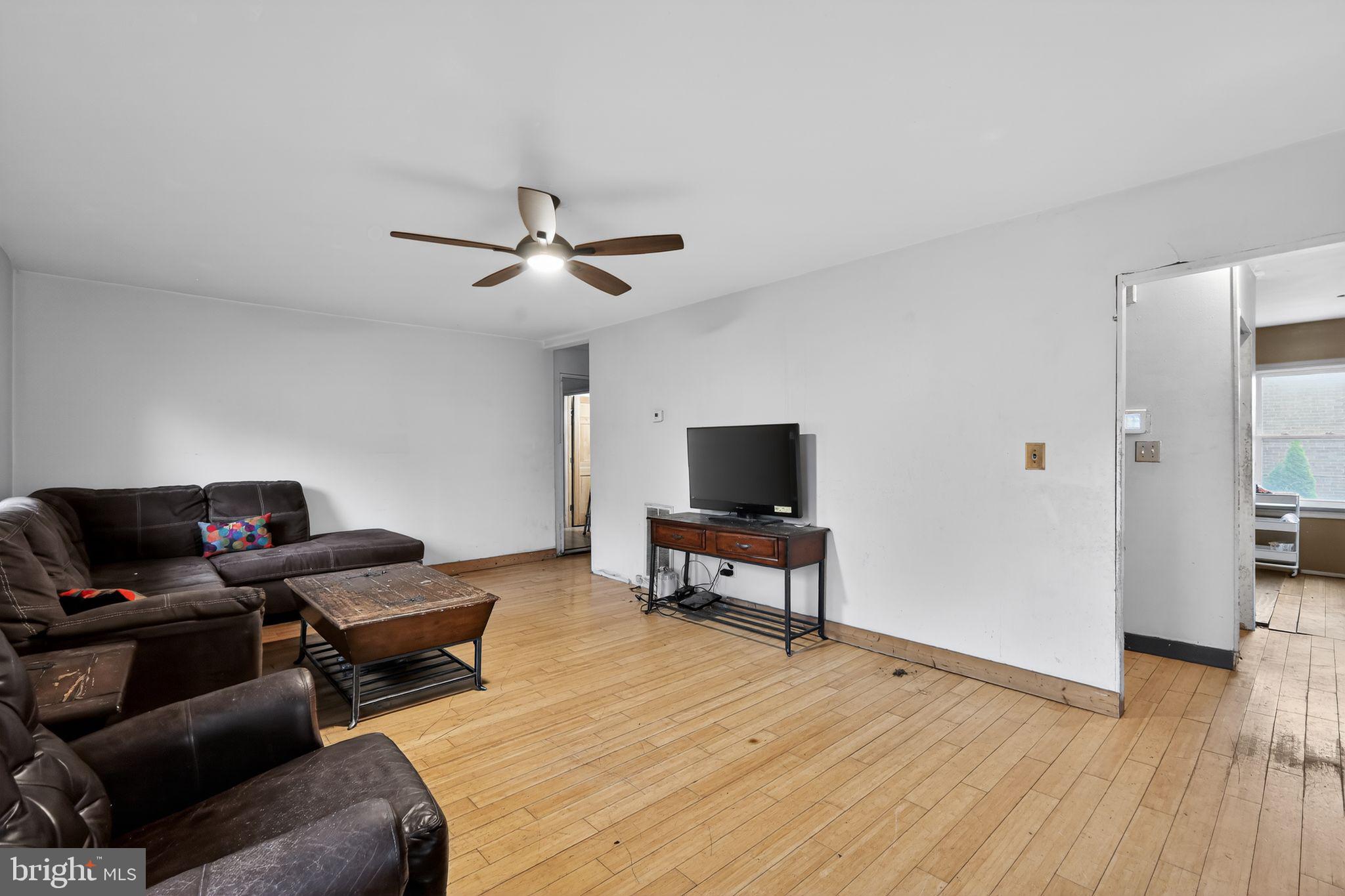 4516 Yates Road Beltsville, MD 20705 - Photo 9 of 31 a living room with furniture and a flat screen tv