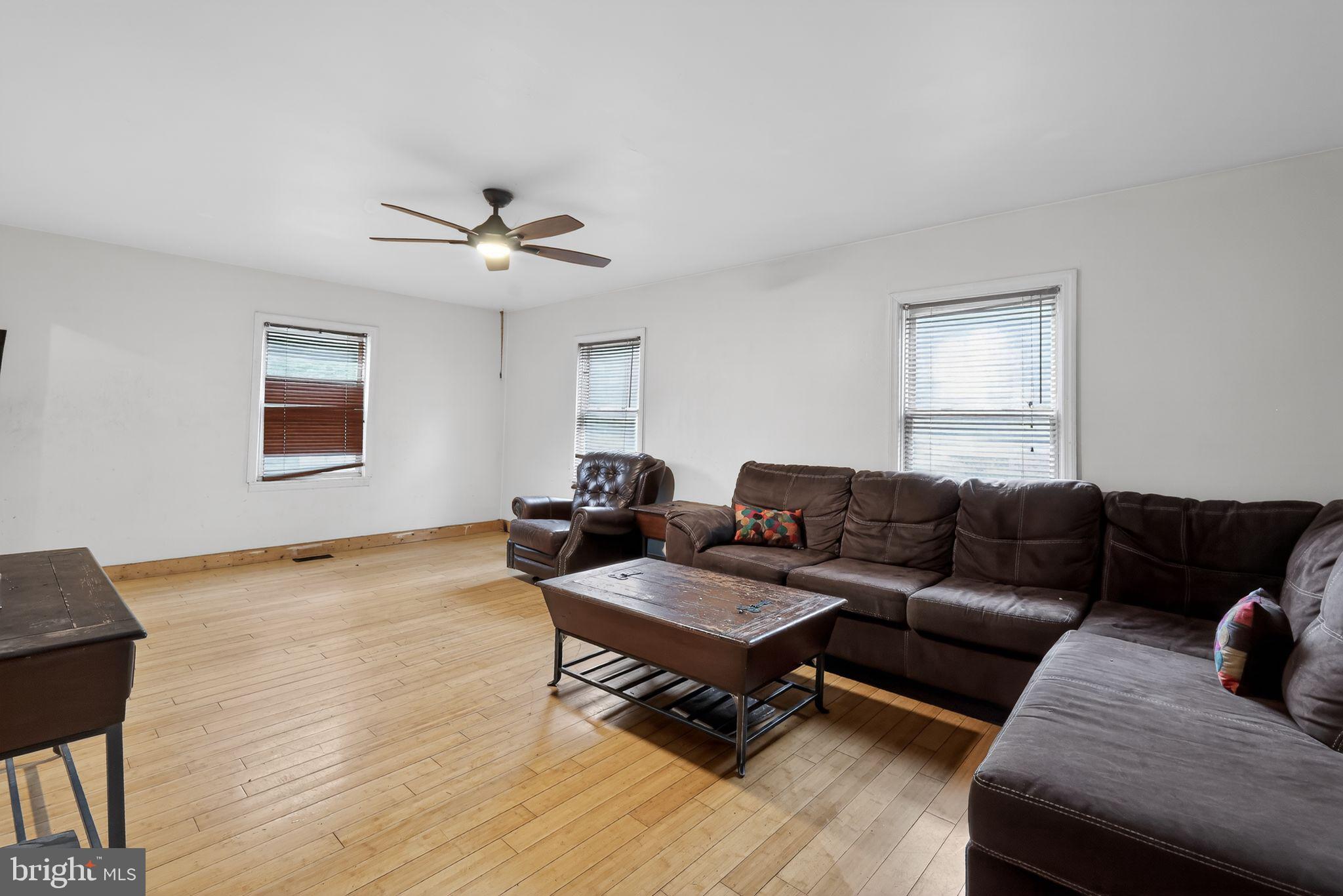 4516 Yates Road Beltsville, MD 20705 - Photo 10 of 31 a living room with furniture and a wooden floor