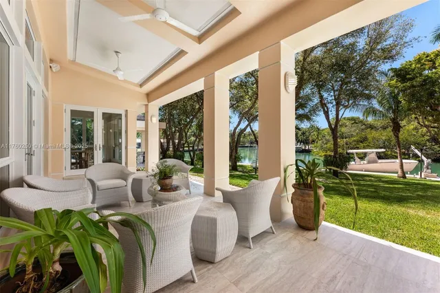 a living room with patio area and garden