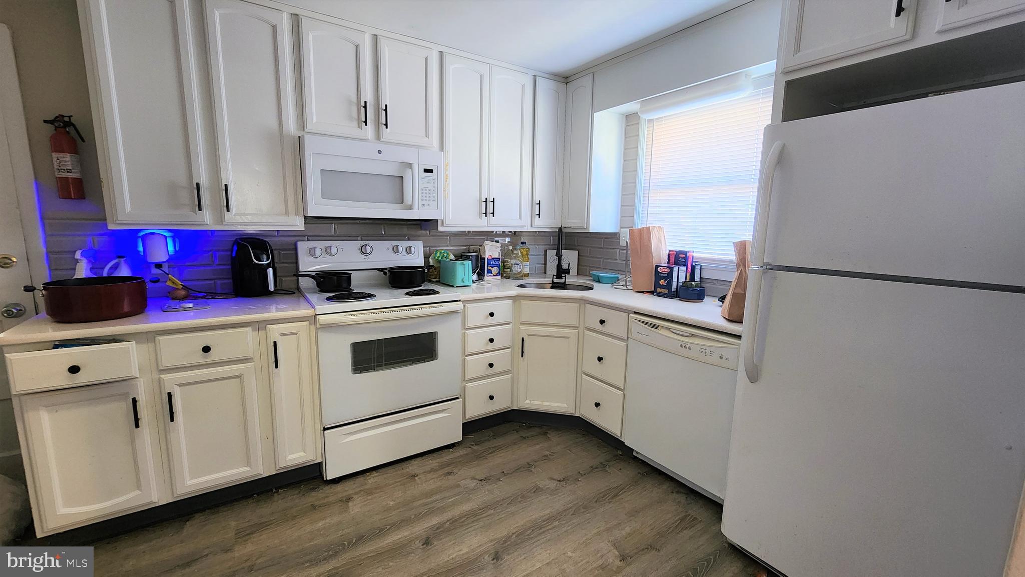 600 Heston Road Glassboro, NJ 08028 - Photo 4 of 9 a kitchen with white cabinets and white appliances
