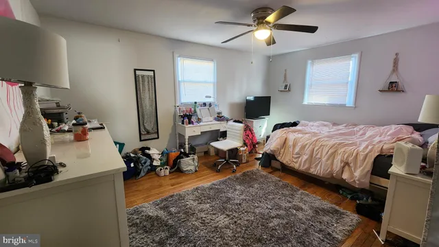 a bed room with a bed mirror and a window