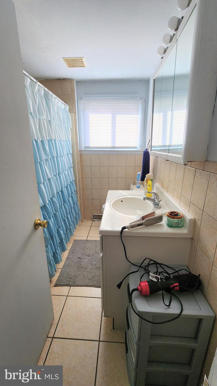 600 Heston Road Glassboro, NJ 08028 - Photo 9 of 9 a bathroom with a sink and a mirror