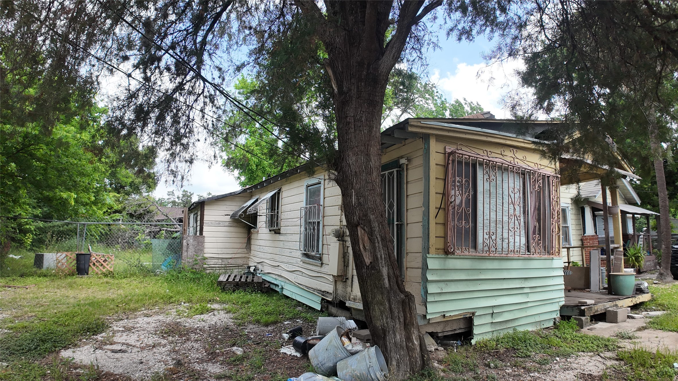7935 Sherman Street Houston, TX 77012 - Photo 19 of 23 a view of a house with a yard