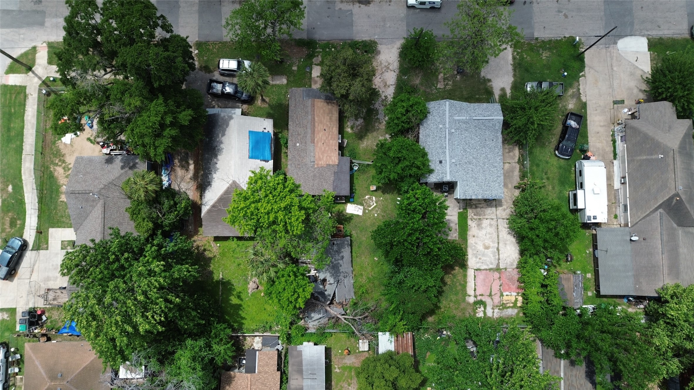 7935 Sherman Street Houston, TX 77012 - Photo 9 of 23 an aerial view of a house with outdoor space and trees all around