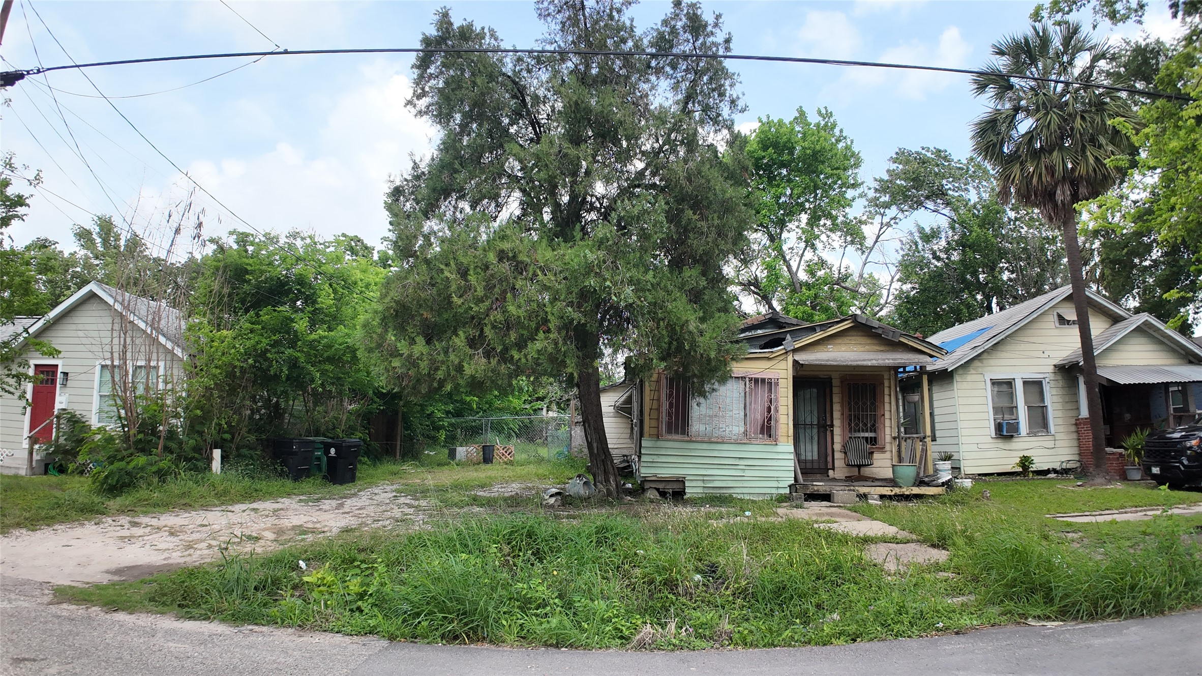 7935 Sherman Street Houston, TX 77012 - Photo 10 of 23 a front view of a house with a yard