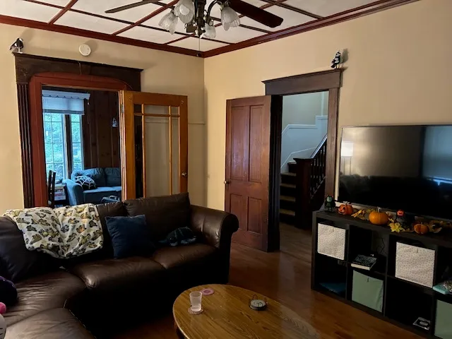 a living room with furniture and a flat screen tv