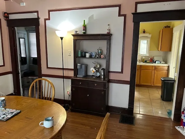a kitchen with a table and chairs