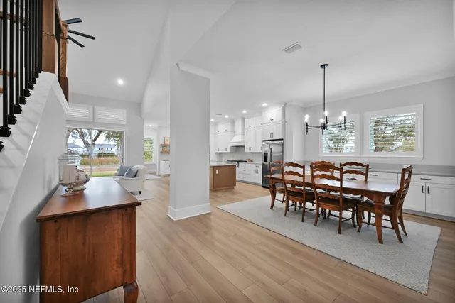 a kitchen with stainless steel appliances a sink a stove top oven a counter space and cabinets