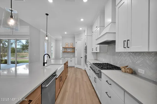 a view of entryway livingroom and hall with wooden floor
