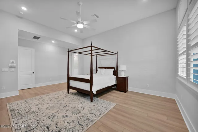 an aerial view of residential houses with yard and swimming pool