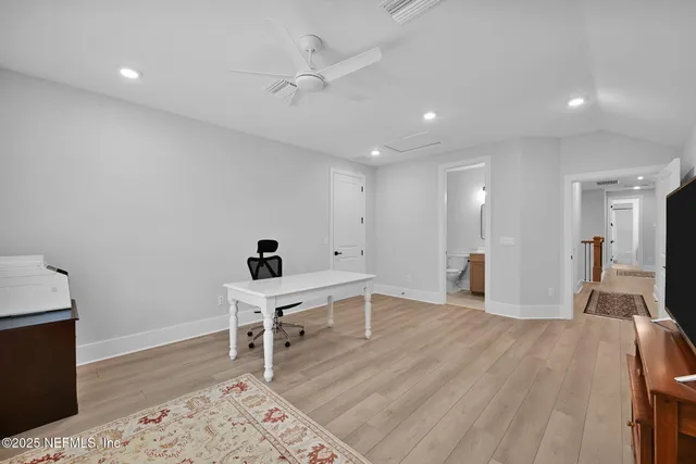 an aerial view of a house with a yard and garden